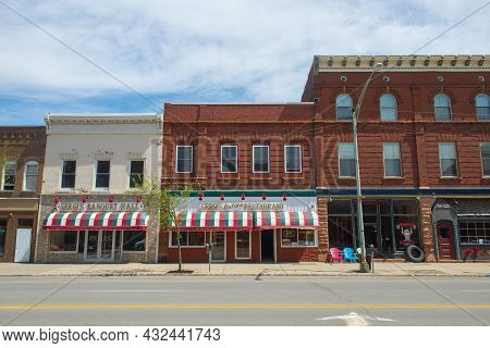 Potsdam, Ny, Usa - Apr. 27, 2017: Historic Sandstone And Brick Commercial Buildings With Italianate 