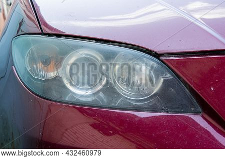 Close-up Front Headlight With Xenon Light Of Red Modern Ca
