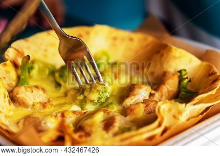 Broccoli And Meat In Molten Cheese On Pita Bread, A Thin Flatbread. A Piece Of Broccoli With Cheese 