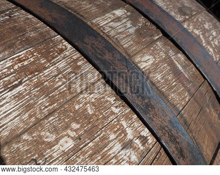 A Traditional Old Wooden Barrel With Curved Walls And Metal Hoops. Dishes For The Ripening Of Alcoho