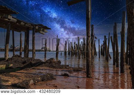 Stary Sky Milky Way Over A Dilapidated Old Pier In Provincetown, Cape Cod, Massachusetts At Night.