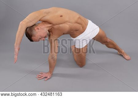 Athletic Yogi Man Do Side Body Stretch Sidebending Yoga Pose Grey Background, Workout