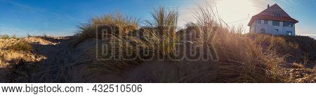 Panorama Of A Sand Dune With A Beachhouse At Koksijde  In Flanders In A Warm Autumnal Light