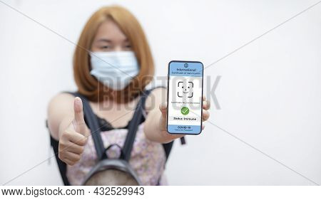 Vaccine Passport Of Travel And Health, Young Woman Showing On Her Smartphone Screen A Certificate Of