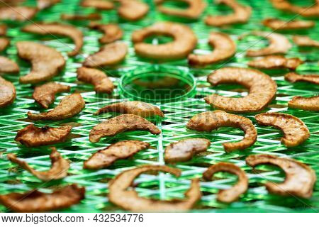 Apple Slices On The Special Drying Device. Preparation Apple Chips At Home.