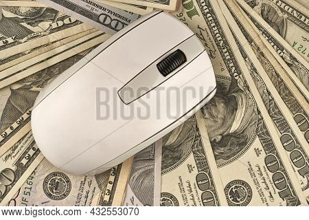 Whithe Computer Mouse Over Different Dollar Bills