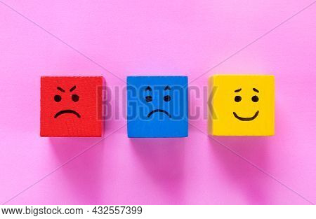 Red, Blue And Yellow Cubes With Cute Faces Depicting Human Emotions: Anger, Sadness And Happiness. C