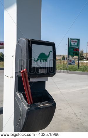 Gardiner, Montana - August 23, 2021: Squeegee Windshield Wiper Fluid Container To Clean Car Windows 