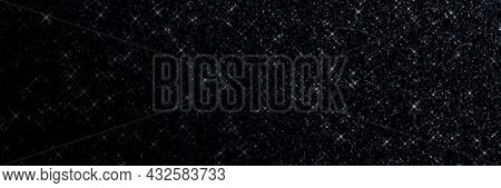 Black glitter textured background and wallpaper