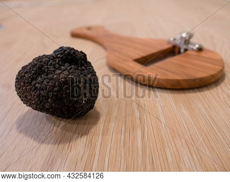 Italian Black Summer Truffle Or Tarfufo Nero Estivo With A Slicer