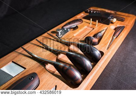 Exclusive Handmade Leather Craft Tools. Close Up Of Different Tanner Tools On Wooden Box. Set Of Dif
