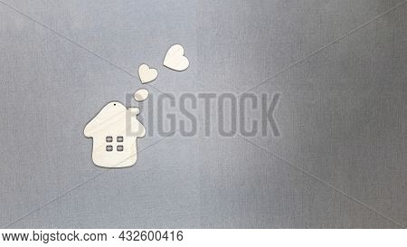 Toy Wooden House With Hearts Flying Out Of The Pipes. The Concept Of The World Of Love And Good Neig