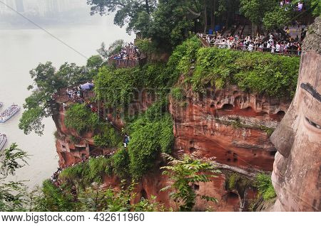 June 24, 2018.  Leshan, China. Tourists Visiting The Ancient Leshang Giant Buddha Statue Located In 