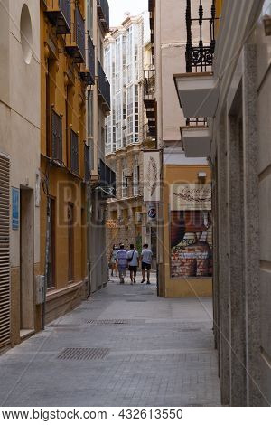 Málaga, Spain - June 19, 2021: People Walking In The Historic Center Of Malaga In Spain