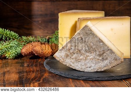 Cheese Collection, French Cow Cheese Comte, Beaufort, Abondance, Tomme De Savoie And Fir Cones