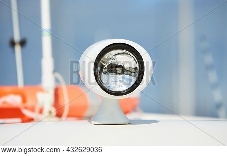 Flood Light On The Roof Of A Boat. Navigation Light For Travelling At Night And The Correct Mooring.