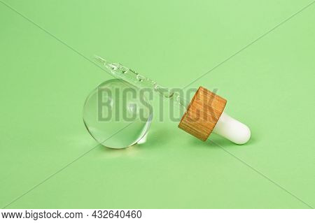 Closeup Photography Of The Pipette With Cosmetics Gel Inside, Bubbly Sructure.pastel Mint Background
