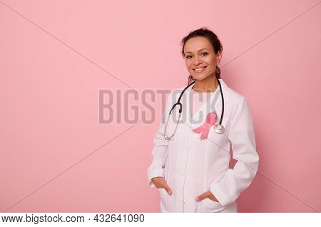 Portrait Of African American Womandoctor In Medical Coat And Pink Ribbon, Stethoscope Around Neck, L