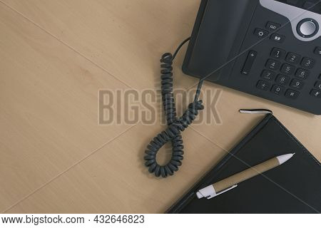 Office Desk With Phone, Notebook And Pen