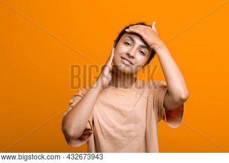 Stroking Face Skin Of Young Indian American Woman Doing Facebuilding Yoga Face Gymnastics Yoga Self 