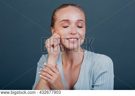 Millenial Young Woman Blonde Hair Portrait Doing Face Yoga Self Facebuilding Massage For Face Skin S