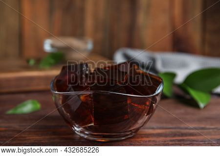 Delicious Grass Jelly Cubes On Wooden Table, Closeup