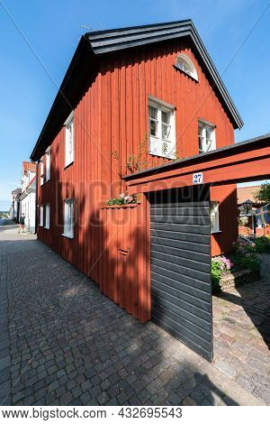 Vastervik, Sweden - 08.23.2021: Wide Vertical Shot Of Old, Traditional Red Wooden House In Scandinav