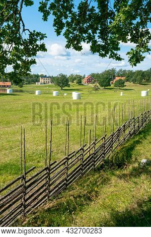 Vertical Shot Of A Small Settlement Farm In Sourthern Sweden On A Beautiful Sunny Summer Day. Holida