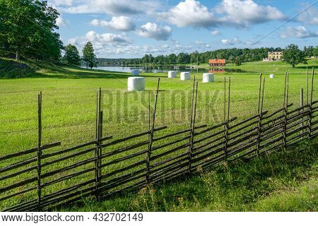 Small Settlement Farm In Sourthern Sweden On A Beautiful Sunny Summer Day. Holiday In Swedish Countr