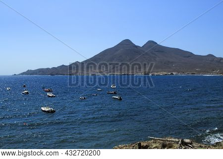 Beautiful Seascape In Isleta Del Moro Village. Volcanous In The Background.