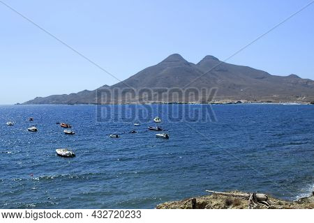 Beautiful Seascape In Isleta Del Moro Village. Volcanous In The Background.
