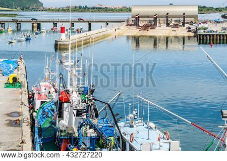 Santona, Spain - July 4, 2021: View Of Colorful Fishing Boats In The Port Of Santona, Cantabria, Nor