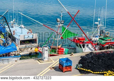 Santona, Spain - July 4, 2021: View Of Colorful Fishing Boats In The Port Of Santona, Cantabria, Nor