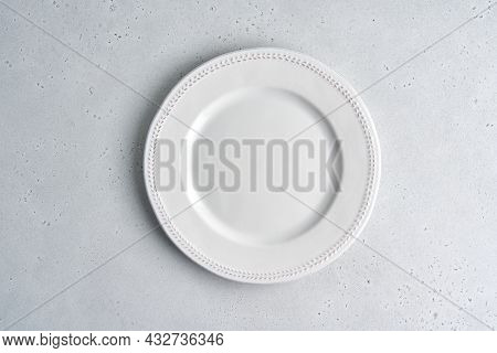Empty White Ceramic Plate On Light Background. Clean Tableware. Serving Preparation. Novody, Above D