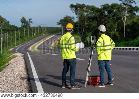 Asian Surveyor Engineers Worker Making Measuring With Theodolite Instrument Equipment During Constru