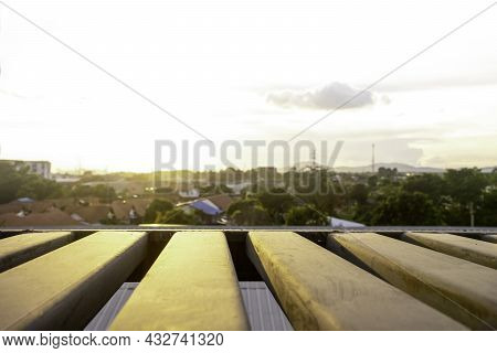 Rooftop View Of Sunset Overbuilding City And Orange Skyline In Thailand, Cityscape With Sun Light At