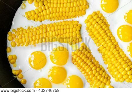 Top Above View Of Many Tasty Healthy Small Chicken Quial Eggs With Boiled Corn Slice Fried On Pan. B