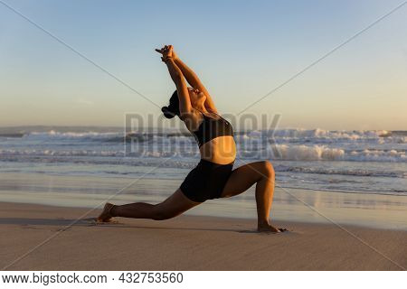 Sunset Beach Yoga. Anjaneyasana, Low Lunge Pose. Crescent Moon Pose. Lunging Back Bending Asana. Sup