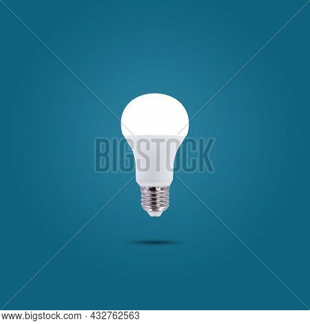 Led Energy Saving Lamp 230v Isolated On Blue Pastel Color Background.