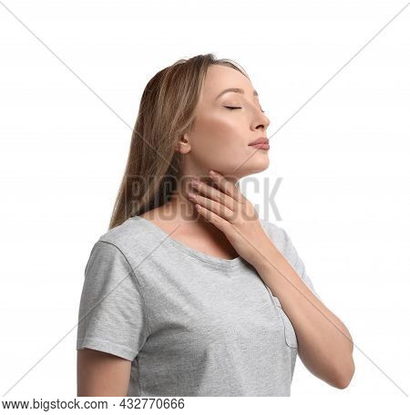 Young Woman Doing Thyroid Self Examination On White Background