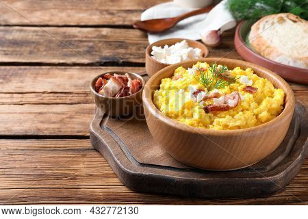 Tasty Banosh Served With Brynza And Pork Cracklings On Wooden Table, Space For Text. Traditional Ukr