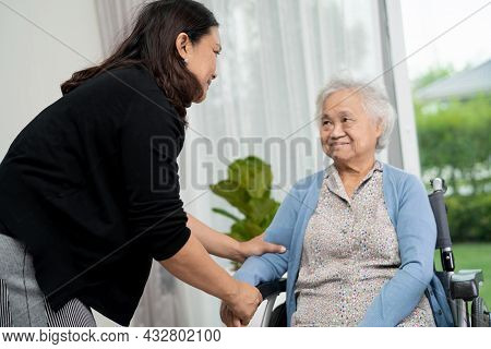 Help And Care Asian Senior Or Elderly Old Lady Woman Patient Sitting On Wheelchair At Nursing Hospit