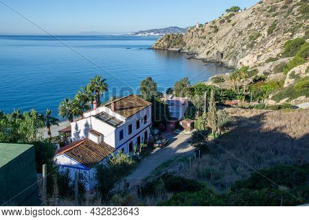 Cañuelo De Nerja Beach Seen From Above With A House And The Watchtower In The Background. Maro Cerro