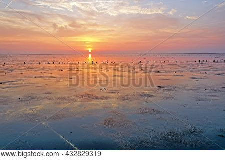Sunset at the Wadden Sea in the Netherlands
