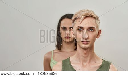 Couple Of Two Young Transgenders Looking At Camera, Supporting, Standing Behind Each Other, Posing T