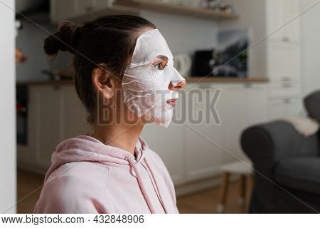 Young Woman With Beauty Mask At Home. Snackable Wellness Concept. Relaxation At Home For Young Mothe