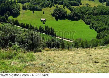  Summer landscape in the Carpathians, Pestera Village, Romania, Europe                              