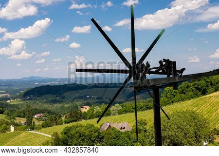 vineyard with windmill called klapotetz in south of Styria, Austria