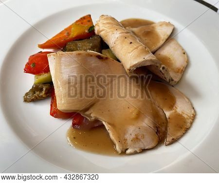 Slices Of Roasted Veal With Vegetables. Italian Cuisine