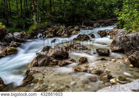 Magic Forest Zauberwald At Lake Hintersee With Creek Ramsauer Ache. National Park Berchtesgadener La